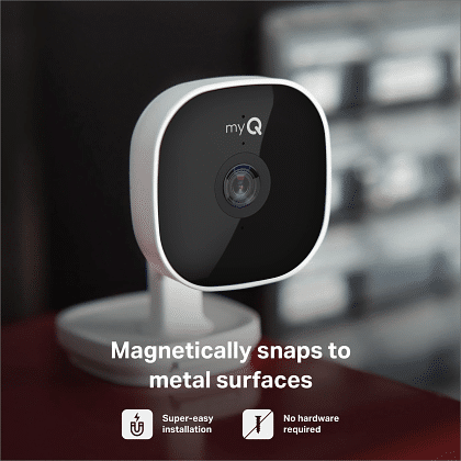 myQ Smart Garage Camera sitting on metal shelf demonstrating magnetic base for easy installation